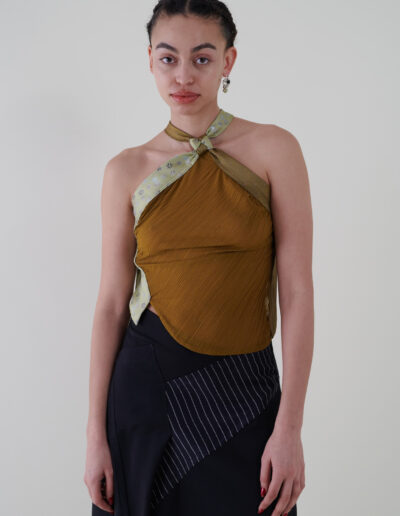 Sustainable fashion with upcycled ties and pleated jersey top from Aldwin Teva William